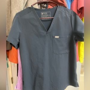 Figs dark harbor one pocket scrub top.